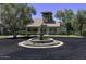 Charming community fountain surrounded by mature trees and lush landscaping at 2333 E Southern Ave # 1015, Tempe, AZ 85282
