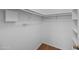 Walk-in closet offers storage with shelves and clothes racks at 2625 E Indian School E Rd # 115, Phoenix, AZ 85016