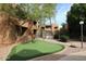 Community common area with green space and walking paths at 2625 E Indian School E Rd # 115, Phoenix, AZ 85016