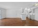 Bright living space featuring wood floors and an open kitchen area at 2625 E Indian School E Rd # 115, Phoenix, AZ 85016