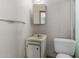 Compact bathroom with a sink, toilet, and a towel bar, all in white at 3302 W Turney Ave, Phoenix, AZ 85017