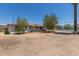 Single story home featuring a front yard with mature trees and a gravel landscape at 3302 W Turney Ave, Phoenix, AZ 85017