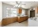Kitchen featuring an old range and a sink with wooden cabinets at 3302 W Turney Ave, Phoenix, AZ 85017