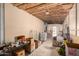 Unfinished basement with packed items and exposed rafters for future renovations at 4065 E University Dr # 141, Mesa, AZ 85205