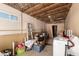 Unfinished basement area with exposed insulation and some storage at 4065 E University Dr # 141, Mesa, AZ 85205