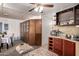 A dining area with ample built-in storage and adjacent kitchen features at 4065 E University Dr # 141, Mesa, AZ 85205