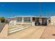 Attractive home with desert landscaping and a covered carport for convenient parking at 4065 E University Dr # 141, Mesa, AZ 85205