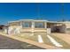 Charming home featuring desert landscaping, mature palm trees, and a welcoming entrance at 4065 E University Dr # 141, Mesa, AZ 85205