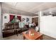 Inviting living room featuring a comfortable leather sofa and adjacent dining area at 4065 E University Dr # 141, Mesa, AZ 85205