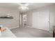 Bright bedroom with neutral carpet and walls, complemented by a closet and view to an adjacent bathroom at 4202 E Broadway Rd # 130, Mesa, AZ 85206