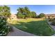 Well-maintained common green area featuring lush grass and landscaping, providing a serene outdoor space at 4202 E Broadway Rd # 130, Mesa, AZ 85206