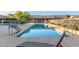 Relaxing community pool area featuring ample seating, well-maintained landscaping, and refreshing, clean water at 4202 E Broadway Rd # 130, Mesa, AZ 85206