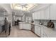 Modern kitchen with white cabinets, granite countertops, stainless steel appliances, and a tile backsplash for the home chef at 4202 E Broadway Rd # 130, Mesa, AZ 85206