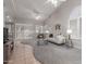 Bright, open living area features vaulted ceiling, neutral paint, plantation shutters, and comfortable furniture for a welcoming ambiance at 4202 E Broadway Rd # 130, Mesa, AZ 85206