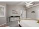 Neutral bedroom featuring a Queen bed, a window with shutters, and carpeted floors at 4202 E Broadway Rd # 130, Mesa, AZ 85206