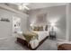 Neutral bedroom featuring a Queen bed, a window with shutters, and carpeted floors at 4202 E Broadway Rd # 130, Mesa, AZ 85206
