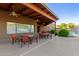 Charming outdoor patio area with ample seating, covered space, and lush landscaping, perfect for relaxation at 4202 E Broadway Rd # 130, Mesa, AZ 85206