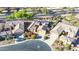 Aerial view of home in a planned community, showcasing desert landscaping, multi-car driveways and tile roofs at 42318 W Abbey Rd, Maricopa, AZ 85138