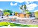 This backyard features a private pool, outdoor bar, and mature trees offering the ultimate outdoor living experience at 42318 W Abbey Rd, Maricopa, AZ 85138