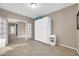 This bedroom features neutral walls and tiled floor, perfect for an inviting guest room or home office at 42318 W Abbey Rd, Maricopa, AZ 85138