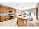 Kitchen featuring a large island with granite countertops, stainless steel appliances and ample cabinets at 42318 W Abbey Rd, Maricopa, AZ 85138