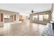 Open concept with tile flooring, a fireplace and expansive windows bringing in natural light at 42318 W Abbey Rd, Maricopa, AZ 85138