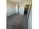 Neutral bedroom features gray carpeting, closet, and white trim at 4236 S 46Th Pl, Phoenix, AZ 85040