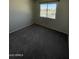 Bright bedroom with plush gray carpet and natural light at 4236 S 46Th Pl, Phoenix, AZ 85040