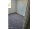 Bedroom features include neutral carpet, natural light, and electrical outlets at 4236 S 46Th Pl, Phoenix, AZ 85040