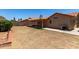 The large backyard features a covered patio area and new landscaping opportunities at 4336 E Aspen Ave, Mesa, AZ 85201