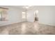 The room contains light tile floors, two windows, and a door to the bathroom at 4336 E Aspen Ave, Mesa, AZ 85201