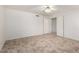 An empty room features light tile flooring and a closet with sliding doors at 4336 E Aspen Ave, Mesa, AZ 85201