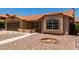 Exterior elevation featuring a desert landscaped yard, sidewalk leading to the front door and a brown two car garage at 4336 E Aspen Ave, Mesa, AZ 85201