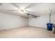 Attached garage with white walls and an automatic garage door opener at 4336 E Aspen Ave, Mesa, AZ 85201
