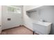 Laundry room with a utility sink and a window with natural light at 4336 E Aspen Ave, Mesa, AZ 85201