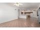 Open floor plan featuring tile floors, white walls, and partial view of the kitchen at 4336 E Aspen Ave, Mesa, AZ 85201