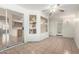 Open sunroom with tiled floors, ceiling fan, an exterior door, and sliding glass doors at 4336 E Aspen Ave, Mesa, AZ 85201
