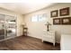 Sunny room featuring wood floors and access to the backyard at 5438 E Avalon Dr, Phoenix, AZ 85018