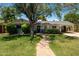 Charming single-story home featuring mature shade tree and covered carport, offering curb appeal and functionality at 5438 E Avalon Dr, Phoenix, AZ 85018