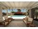 Relaxing covered patio overlooking the backyard swimming pool, perfect for outdoor entertaining and leisure at 5438 E Avalon Dr, Phoenix, AZ 85018