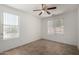 Bedroom with neutral walls and tile floors, bright natural light at 6515 W Hughes Dr, Phoenix, AZ 85043