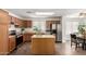 Kitchen with wooden cabinets, stainless steel appliances, and a center island at 6515 W Hughes Dr, Phoenix, AZ 85043