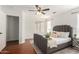Well-lit bedroom with wood floors and stylish decor and furnishings at 6515 W Hughes Dr, Phoenix, AZ 85043