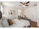 Comfortable bedroom with natural light, wood floors and modern artwork at 6515 W Hughes Dr, Phoenix, AZ 85043