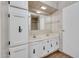 Bright bathroom features a double sink vanity with cabinet storage, plus a framed mirror at 6960 W Peoria Ave # 74, Peoria, AZ 85345