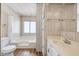 Light-filled bathroom features a soaking tub and a single sink vanity at 6960 W Peoria Ave # 74, Peoria, AZ 85345