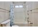 Neutral bathroom featuring a shower-tub combo with silver hardware at 6960 W Peoria Ave # 74, Peoria, AZ 85345