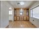 Dining room with hardwood floors, built-in cabinets, and a view into the bright kitchen, perfect for entertaining at 6960 W Peoria Ave # 74, Peoria, AZ 85345
