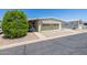 Inviting single-story home featuring desert landscaping, a carport, and a well-maintained exterior at 6960 W Peoria Ave # 74, Peoria, AZ 85345