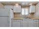 This well-equipped kitchen features a refrigerator, dishwasher, stainless steel sink and lots of cabinet space at 6960 W Peoria Ave # 74, Peoria, AZ 85345